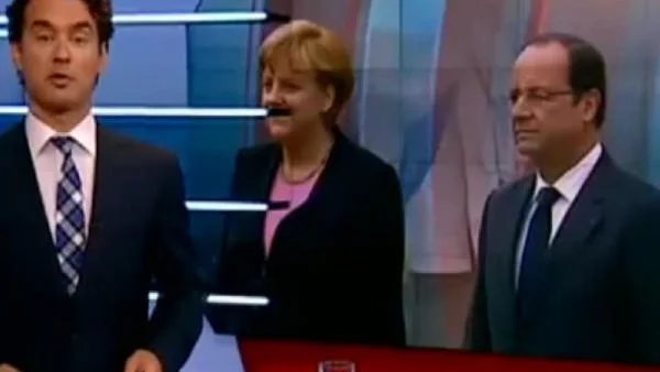 Холандски ТВ гаф: Меркел по хитлеристки мустаци (Видео)