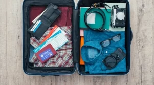 Как да опаковате много багаж в малък куфар (Видео)